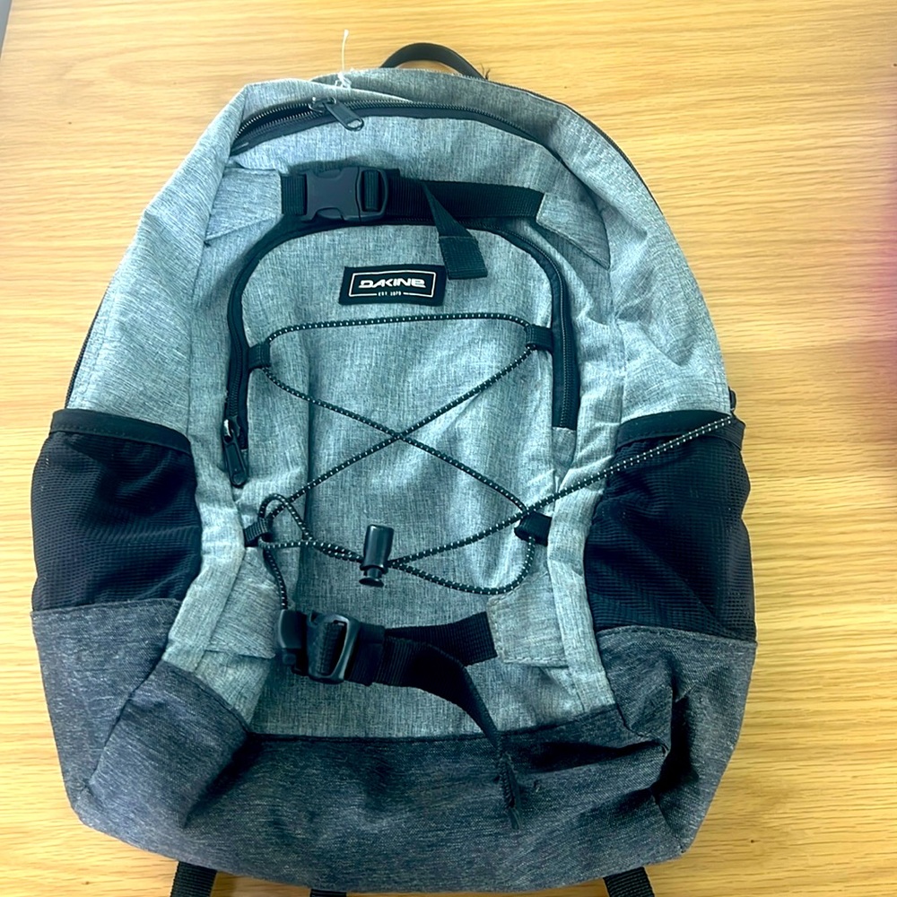 Dakine kids backpack 13L with main compartment and small compartment.